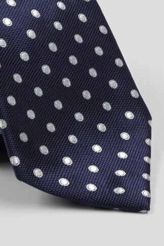 Teget kravata sa belim kružićima